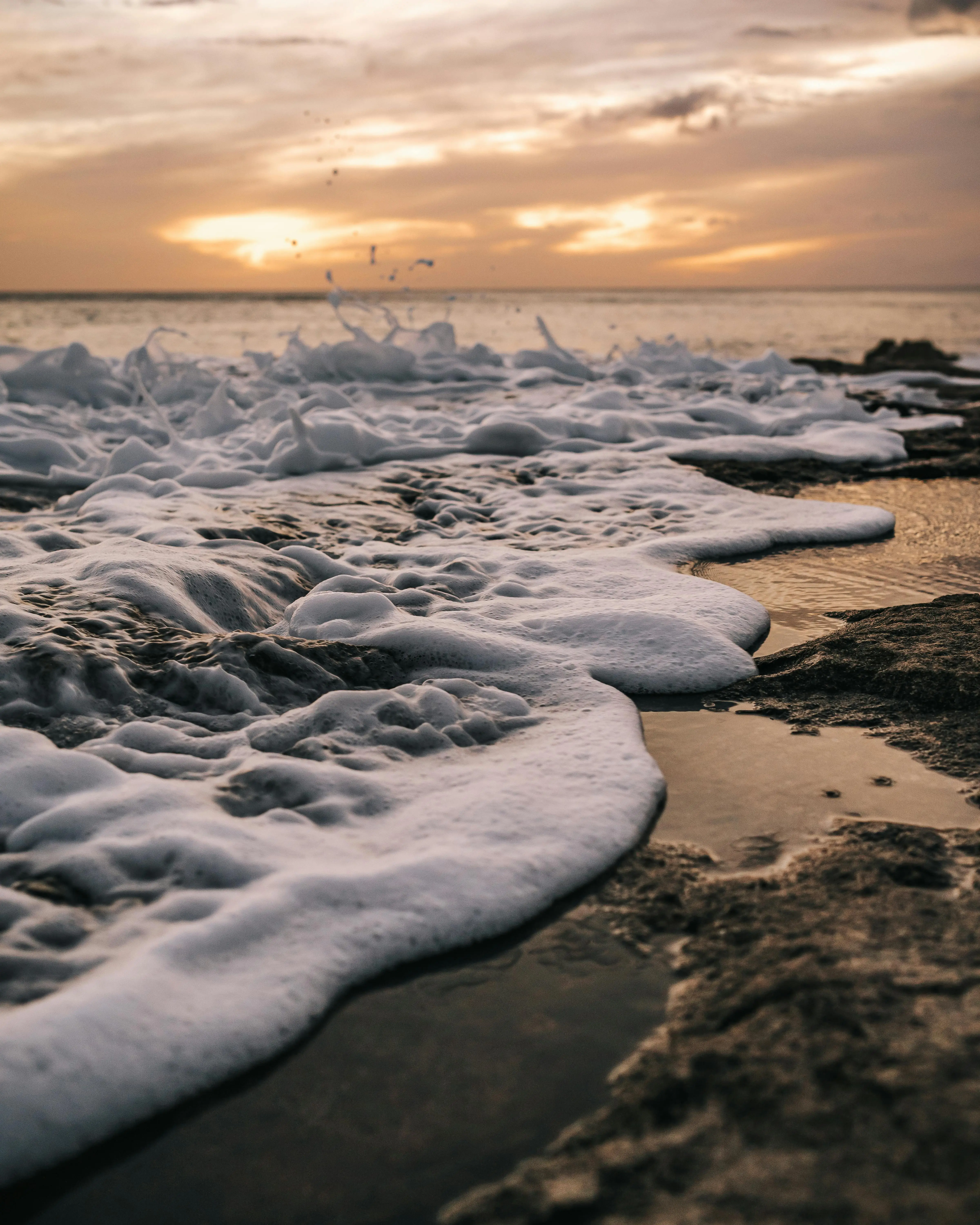 Close up of a wave crashing on the coastline